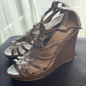 Very worn chocolate wedges. Size 8.